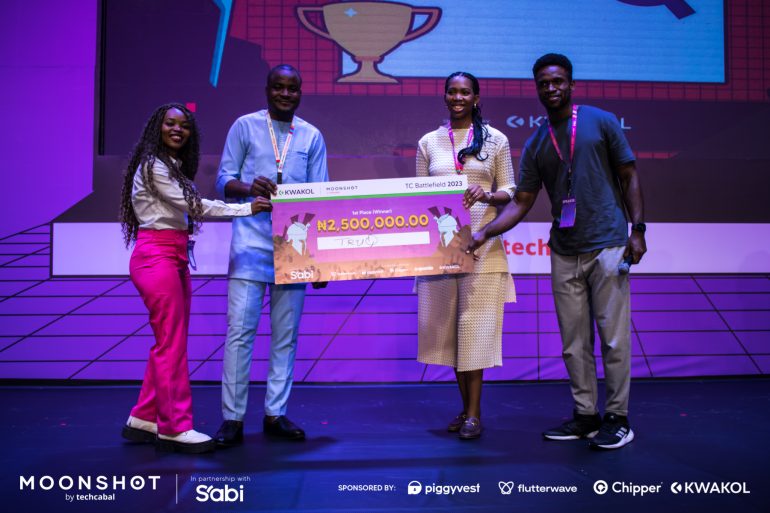 Logistics company, TruQ, receiving a cheque of 2.5 million naira at TechCabal's Startup Battlefield 2023